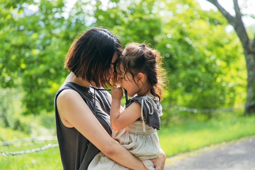 Mother hugging child